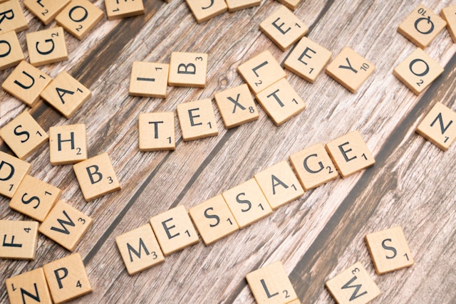 scrabble pieces with the world "message" arranged